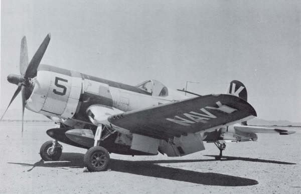AngelofOkinawa1957 F4U-4 Corsair NAS Olathe”, “Light Gull Gray scheme”, “Corsair restoration reference”.