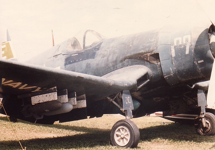 F4U-4Corsair97369 F4U-4 Corsair NAS Olathe”, “Light Gull Gray scheme”, “Corsair restoration reference”.