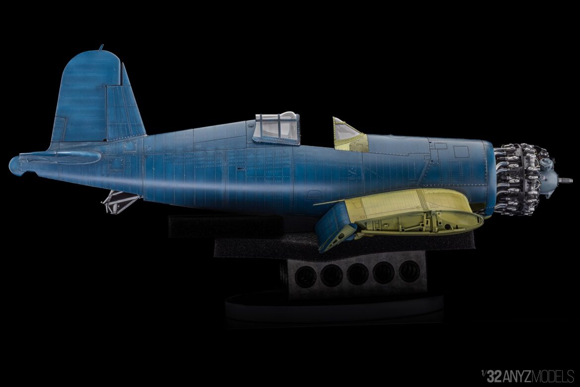 F4U Corsair 1/32 Tamiya model in factory assembly line stage with exposed structure and primer