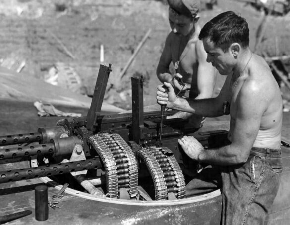 Servicing the four guns in the top turret of a P 61 Black Widow Four 127 mm Brownings