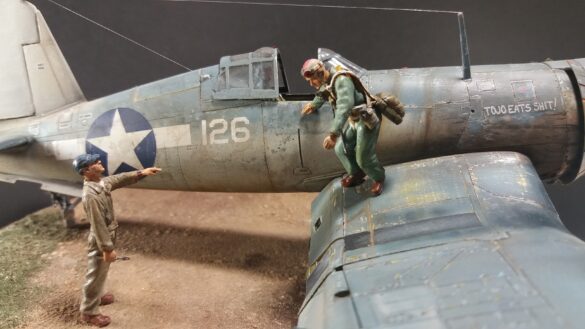 "Heavily weathered underside of F4U-1 Corsair 126 with realistic oil and dust effects simulating coral strip operations".