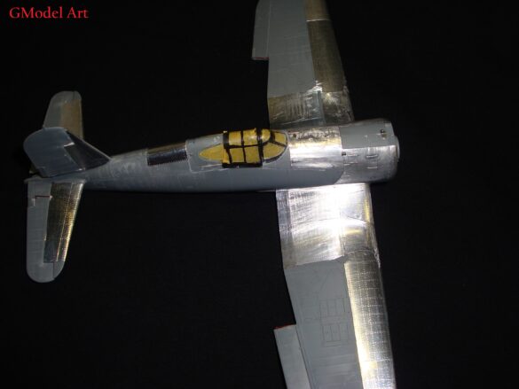 "Heavily weathered underside of F4U-1 Corsair 126 with realistic oil and dust effects simulating coral strip operations".