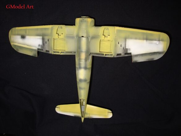 "Heavily weathered underside of F4U-1 Corsair 126 with realistic oil and dust effects simulating coral strip operations".