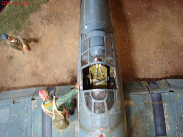 "Heavily weathered underside of F4U-1 Corsair 126 with realistic oil and dust effects simulating coral strip operations".