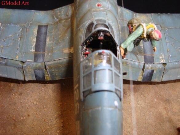 "Heavily weathered underside of F4U-1 Corsair 126 with realistic oil and dust effects simulating coral strip operations".