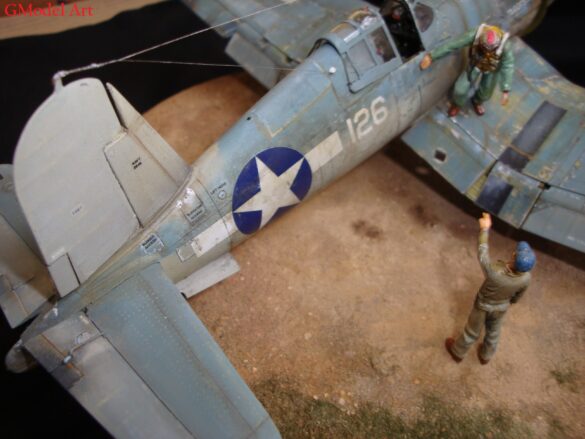"Heavily weathered underside of F4U-1 Corsair 126 with realistic oil and dust effects simulating coral strip operations".