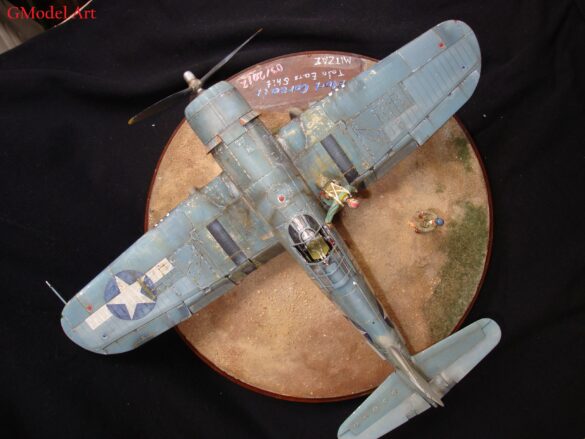 "Heavily weathered underside of F4U-1 Corsair 126 with realistic oil and dust effects simulating coral strip operations".