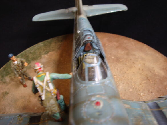 "Heavily weathered underside of F4U-1 Corsair 126 with realistic oil and dust effects simulating coral strip operations".
