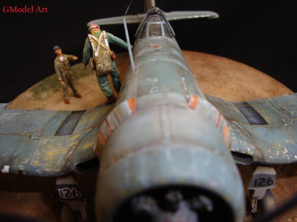 "Heavily weathered underside of F4U-1 Corsair 126 with realistic oil and dust effects simulating coral strip operations".