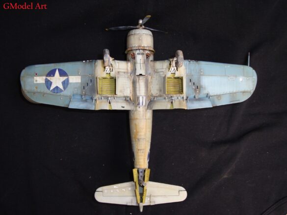 "Heavily weathered underside of F4U-1 Corsair 126 with realistic oil and dust effects simulating coral strip operations".