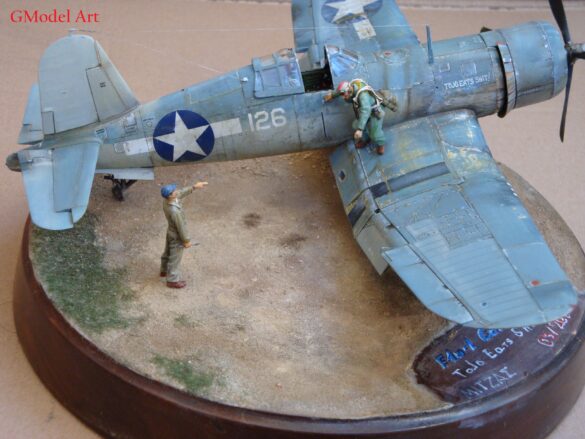 "Heavily weathered underside of F4U-1 Corsair 126 with realistic oil and dust effects simulating coral strip operations".