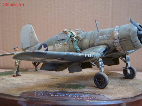 "Heavily weathered underside of F4U-1 Corsair 126 with realistic oil and dust effects simulating coral strip operations".
