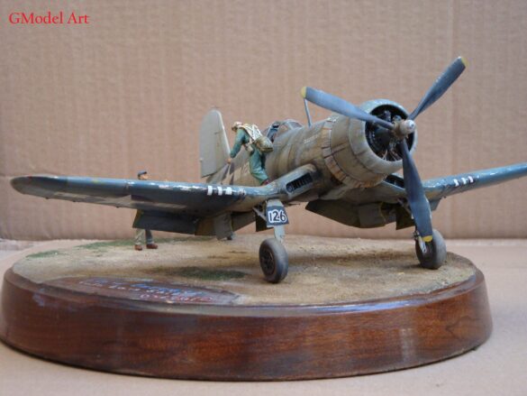 "Heavily weathered underside of F4U-1 Corsair 126 with realistic oil and dust effects simulating coral strip operations".