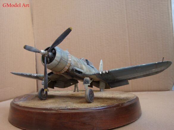 "Heavily weathered underside of F4U-1 Corsair 126 with realistic oil and dust effects simulating coral strip operations".