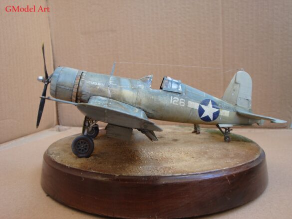 "Heavily weathered underside of F4U-1 Corsair 126 with realistic oil and dust effects simulating coral strip operations".
