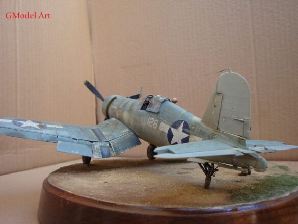 "Heavily weathered underside of F4U-1 Corsair 126 with realistic oil and dust effects simulating coral strip operations".