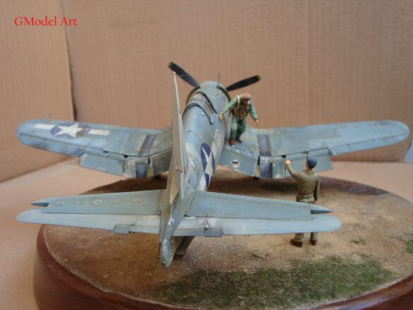 "Heavily weathered underside of F4U-1 Corsair 126 with realistic oil and dust effects simulating coral strip operations".