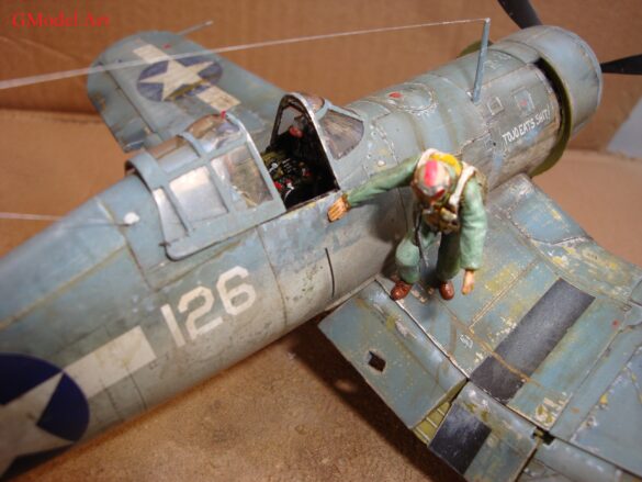 "Heavily weathered underside of F4U-1 Corsair 126 with realistic oil and dust effects simulating coral strip operations".