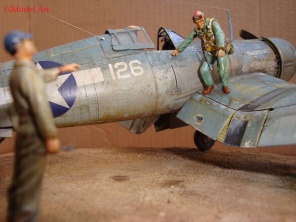 "Heavily weathered underside of F4U-1 Corsair 126 with realistic oil and dust effects simulating coral strip operations".