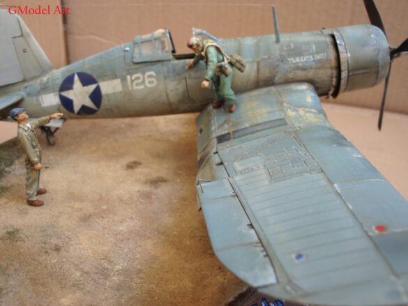 "Heavily weathered underside of F4U-1 Corsair 126 with realistic oil and dust effects simulating coral strip operations".