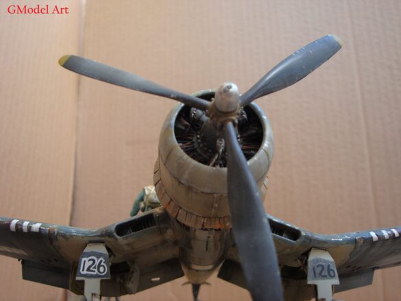 "Heavily weathered underside of F4U-1 Corsair 126 with realistic oil and dust effects simulating coral strip operations".