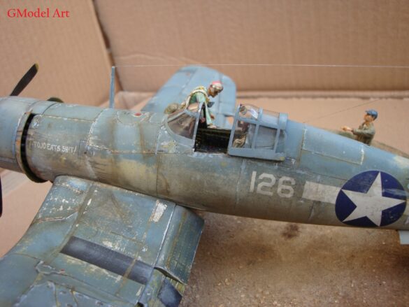 "Heavily weathered underside of F4U-1 Corsair 126 with realistic oil and dust effects simulating coral strip operations".