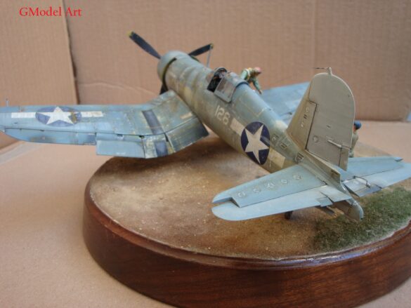 "Heavily weathered underside of F4U-1 Corsair 126 with realistic oil and dust effects simulating coral strip operations".