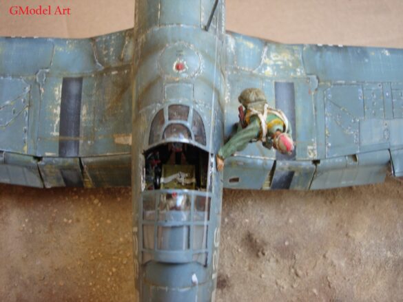 "Heavily weathered underside of F4U-1 Corsair 126 with realistic oil and dust effects simulating coral strip operations".