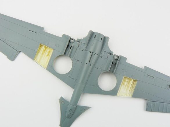 1/48 P-40M RNZAF scale model with open panels and detailed interior, expertly weathered to represent a derelict aircraft.”
