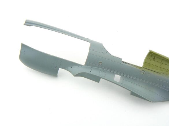 1/48 P-40M RNZAF scale model with open panels and detailed interior, expertly weathered to represent a derelict aircraft.”