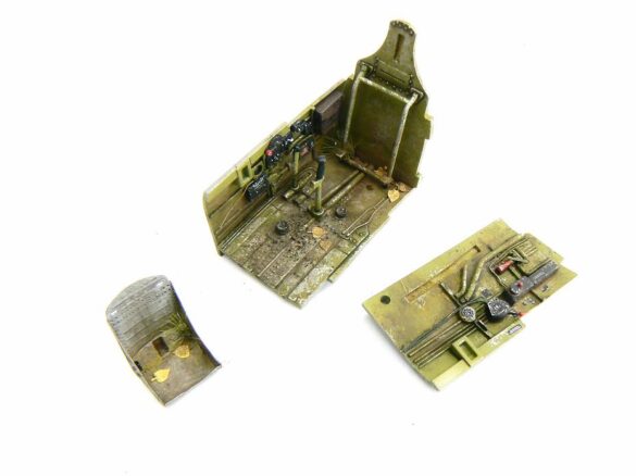 1/48 P-40M RNZAF scale model with open panels and detailed interior, expertly weathered to represent a derelict aircraft.”