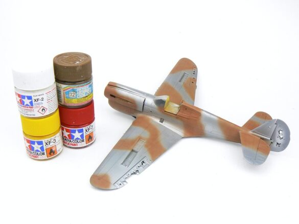 1/48 P-40M RNZAF scale model with open panels and detailed interior, expertly weathered to represent a derelict aircraft.”