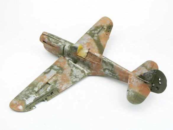 1/48 P-40M RNZAF scale model with open panels and detailed interior, expertly weathered to represent a derelict aircraft.”