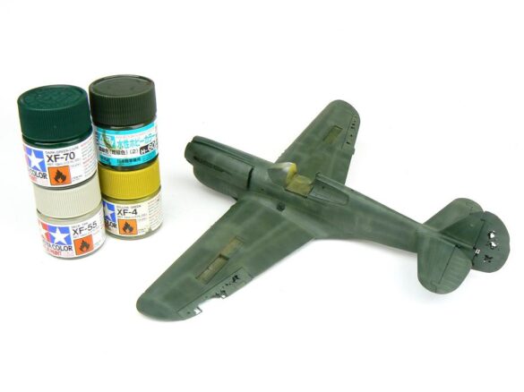 1/48 P-40M RNZAF scale model with open panels and detailed interior, expertly weathered to represent a derelict aircraft.”