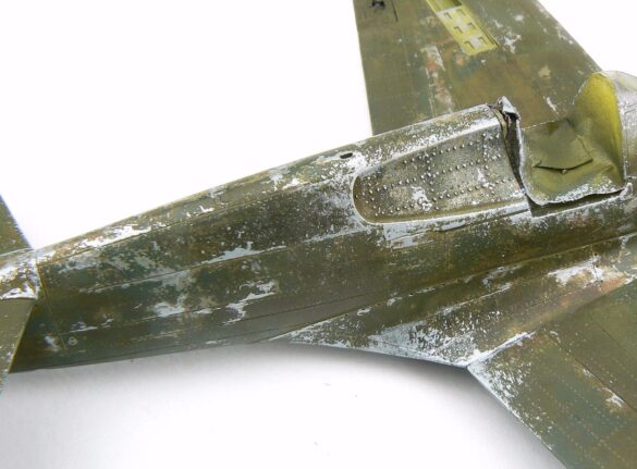 1/48 P-40M RNZAF scale model with open panels and detailed interior, expertly weathered to represent a derelict aircraft.”