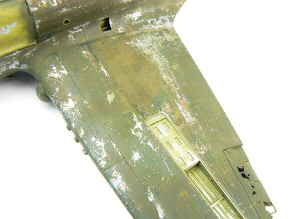 1/48 P-40M RNZAF scale model with open panels and detailed interior, expertly weathered to represent a derelict aircraft.”