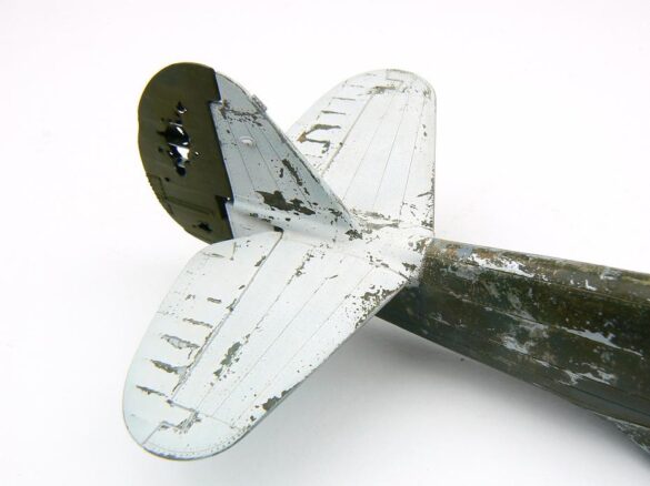 1/48 P-40M RNZAF scale model with open panels and detailed interior, expertly weathered to represent a derelict aircraft.”