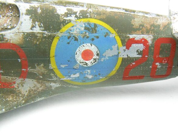 1/48 P-40M RNZAF scale model with open panels and detailed interior, expertly weathered to represent a derelict aircraft.”
