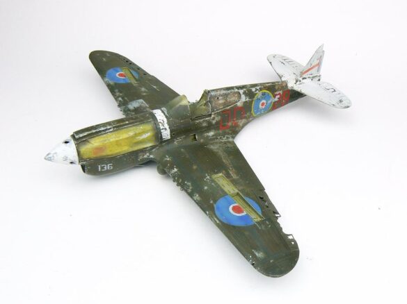 1/48 P-40M RNZAF scale model with open panels and detailed interior, expertly weathered to represent a derelict aircraft.”
