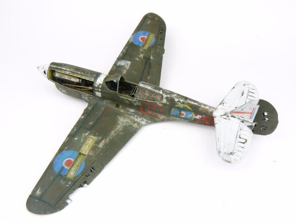1/48 P-40M RNZAF scale model with open panels and detailed interior, expertly weathered to represent a derelict aircraft.”
