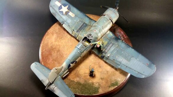 "Heavily weathered underside of F4U-1 Corsair 126 with realistic oil and dust effects simulating coral strip operations".