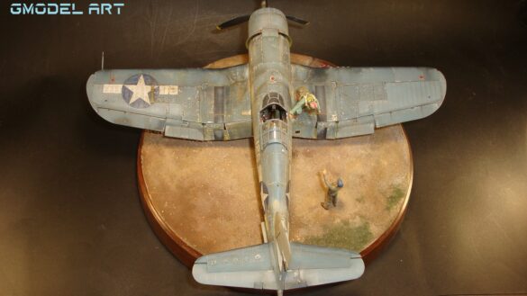 "Heavily weathered underside of F4U-1 Corsair 126 with realistic oil and dust effects simulating coral strip operations".