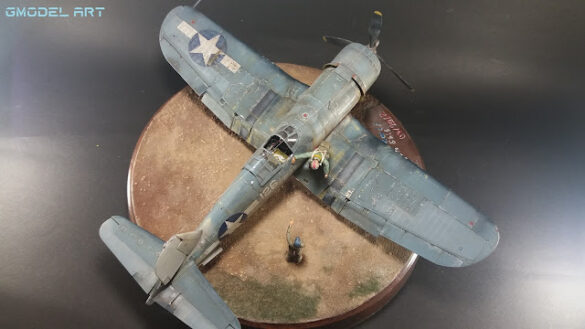 "Heavily weathered underside of F4U-1 Corsair 126 with realistic oil and dust effects simulating coral strip operations".