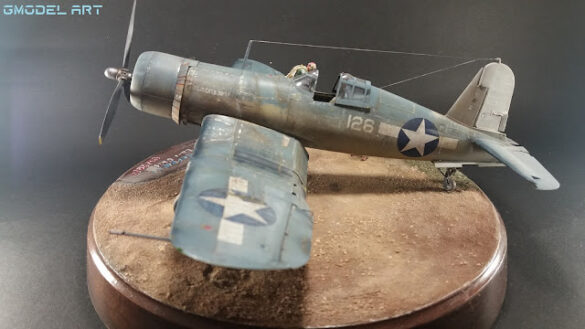 "Heavily weathered underside of F4U-1 Corsair 126 with realistic oil and dust effects simulating coral strip operations".