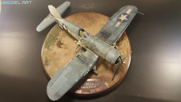 "Heavily weathered underside of F4U-1 Corsair 126 with realistic oil and dust effects simulating coral strip operations".
