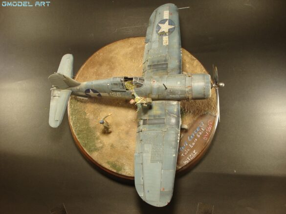 "Heavily weathered underside of F4U-1 Corsair 126 with realistic oil and dust effects simulating coral strip operations".