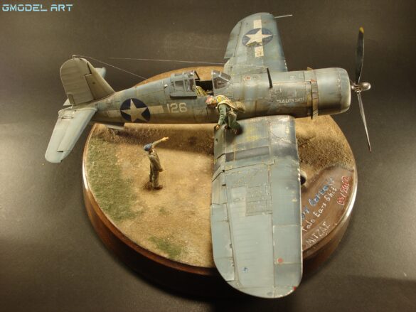 "Heavily weathered underside of F4U-1 Corsair 126 with realistic oil and dust effects simulating coral strip operations".
