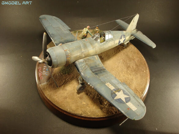 "Heavily weathered underside of F4U-1 Corsair 126 with realistic oil and dust effects simulating coral strip operations".