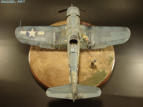 "Heavily weathered underside of F4U-1 Corsair 126 with realistic oil and dust effects simulating coral strip operations".