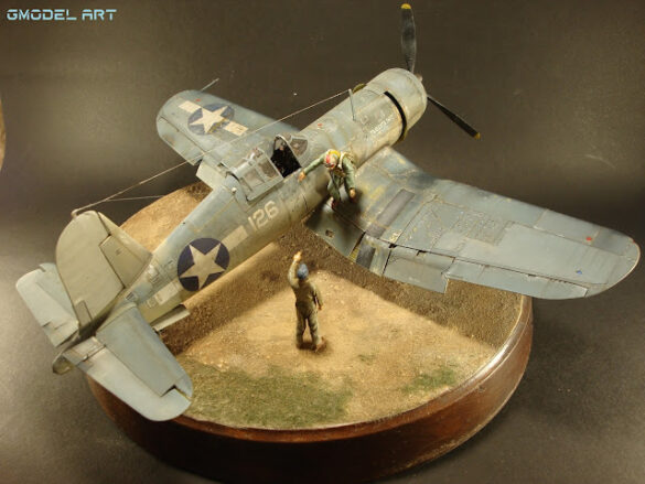 "Heavily weathered underside of F4U-1 Corsair 126 with realistic oil and dust effects simulating coral strip operations".